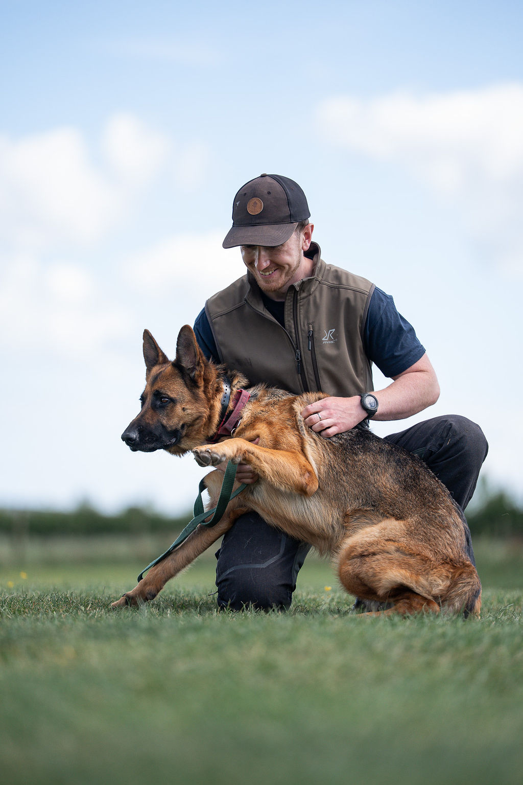 Kit Rowland building confidence with a German Shepherd in a field