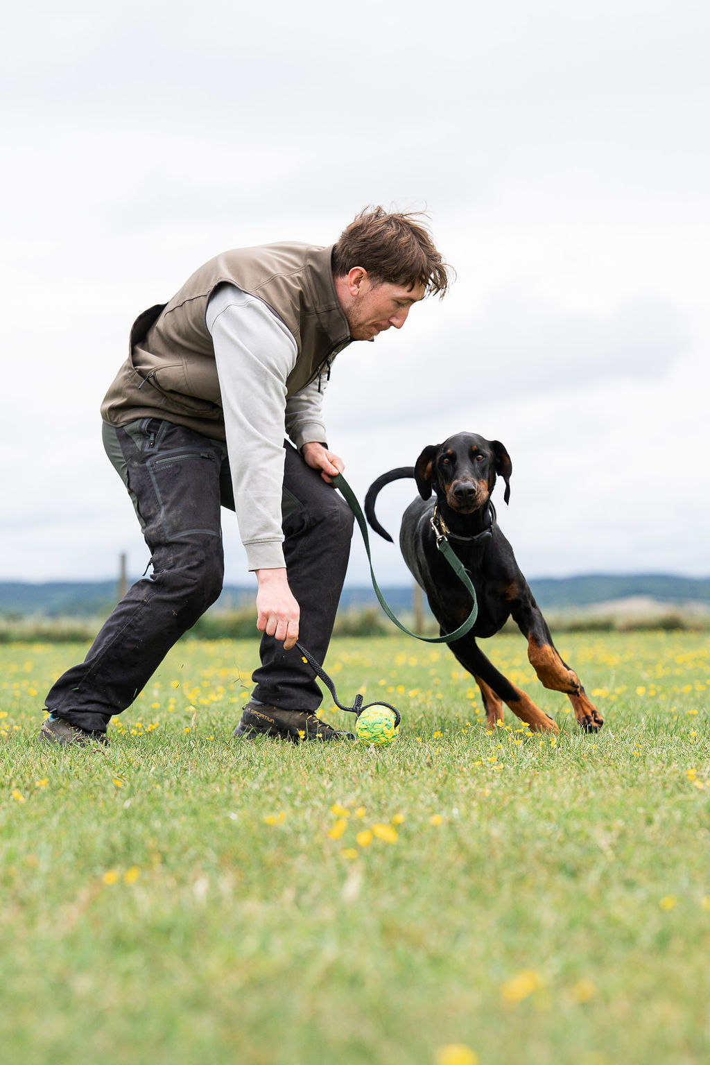 Kit Rowland training a Doberman on the lead outdoors
